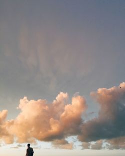 Low angle view of people against sky