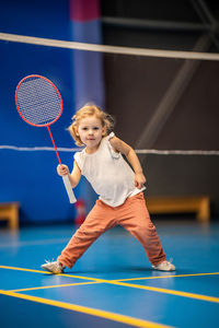 Boy playing tennis