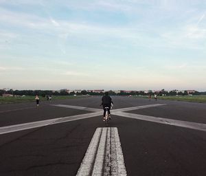 Man on road against sky