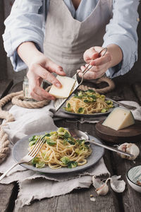 Midsection of man preparing food on table