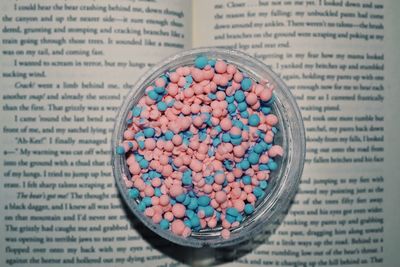 High angle view of multi colored candies in container