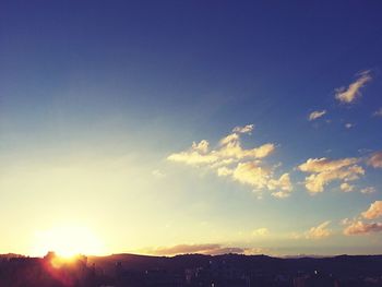 Landscape against sky at sunset