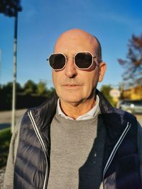 Portrait of man wearing sunglasses standing outdoors