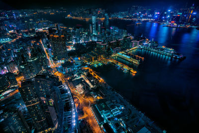 High angle view of illuminated city buildings at night