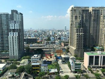 High angle view of buildings in city against sky