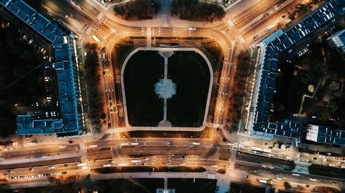 Aerial view of city lit up at night