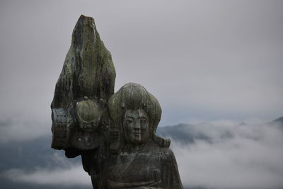 Low angle view of statue against sky