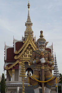 Low angle view of temple against building