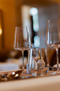 Close-up of wineglasses on table