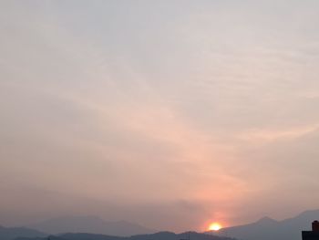 Low angle view of silhouette mountain against sky during sunset