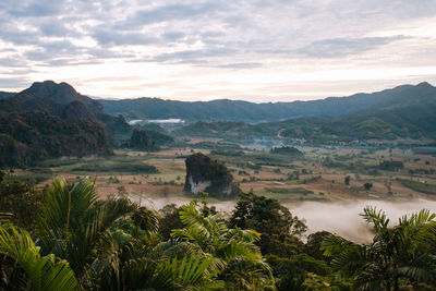 Scenic view of landscape and mountains against sky