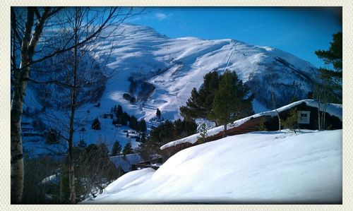 Scenic view of snow covered mountains