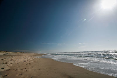 Scenic view of beach against clear sky