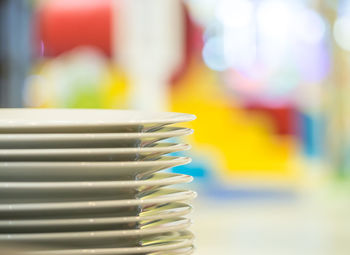 Close-up of stacked empty plates
