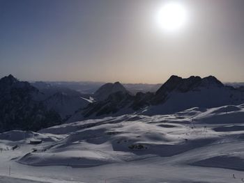 Scenic view of snowcapped mountains against clear sky