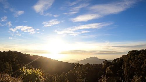 Scenic view of mountains against sky at sunset