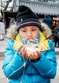 Portrait of boy in park during winter