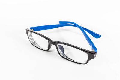 High angle view of eyeglasses on gray background