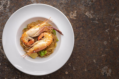 High angle view of noodles in plate on table