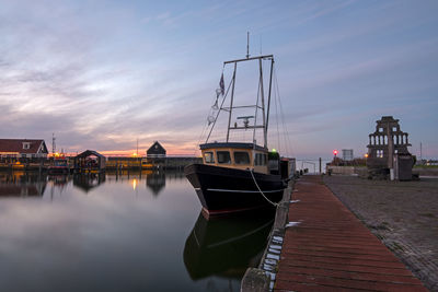 Harbor from the historical village hindeloopen in friesland the netherlands at sunset