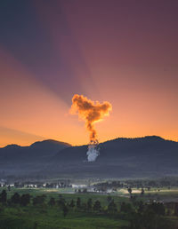 Scenic view of field against sky during sunset