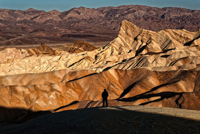 Scenic view of desert against mountain range