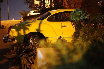 Cars on road at sunset