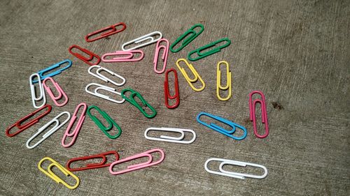 Close-up of colorful paper clips on table