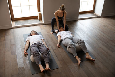 Full length of woman sitting on floor