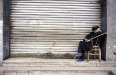 Security guard sleeping outside closed shop