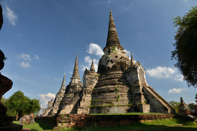 Low angle view of old temple building against sky