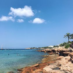 Scenic view of sea against blue sky