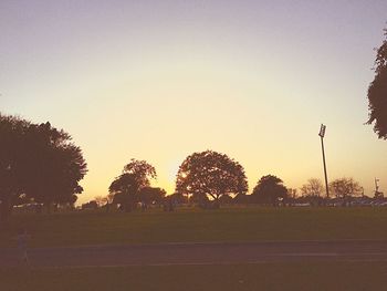 Silhouette trees against sky during sunset