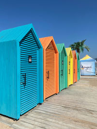 Beach huts against blue sky