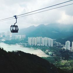 Overhead cable car against sky