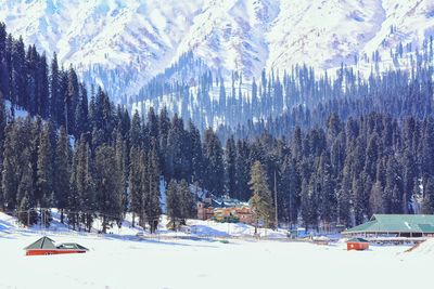 Scenic view of snow covered landscape and mountains