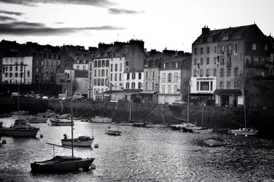 Boats moored at harbor