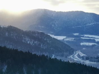 Scenic view of snowcapped mountains against sky