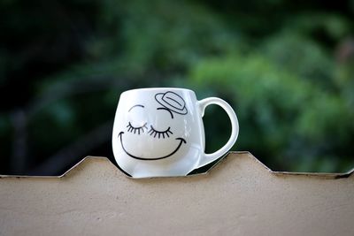 Close-up of coffee cup on table