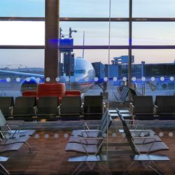 Empty chairs in lobby at airport