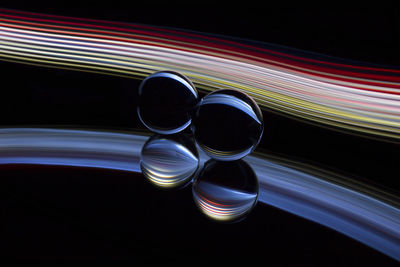 Close-up of light painting against black background