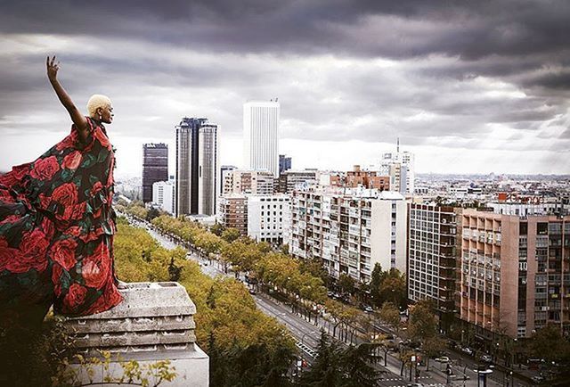 building exterior, architecture, built structure, city, sky, skyscraper, cloud - sky, tall - high, tower, modern, cloudy, cityscape, office building, urban skyline, tree, cloud, building, overcast, travel destinations, city life