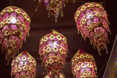 Low angle view of multi colored decorations hanging in market stall