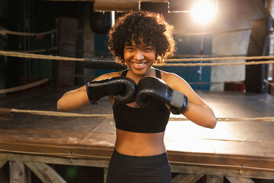 Young woman exercising in gym