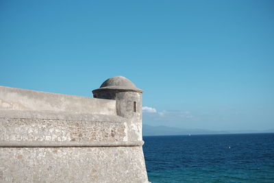 Scenic view of sea against clear blue sky