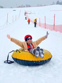 Woman with umbrella on snow