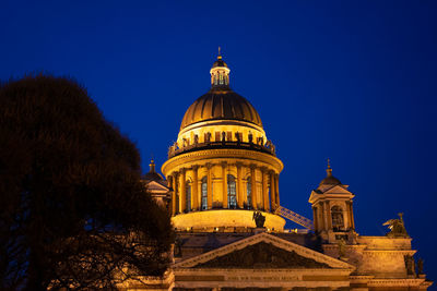 Cathedral of building against clear sky at night
