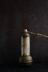 Close-up of cross on table