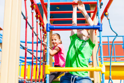 Children playing on slide at playground