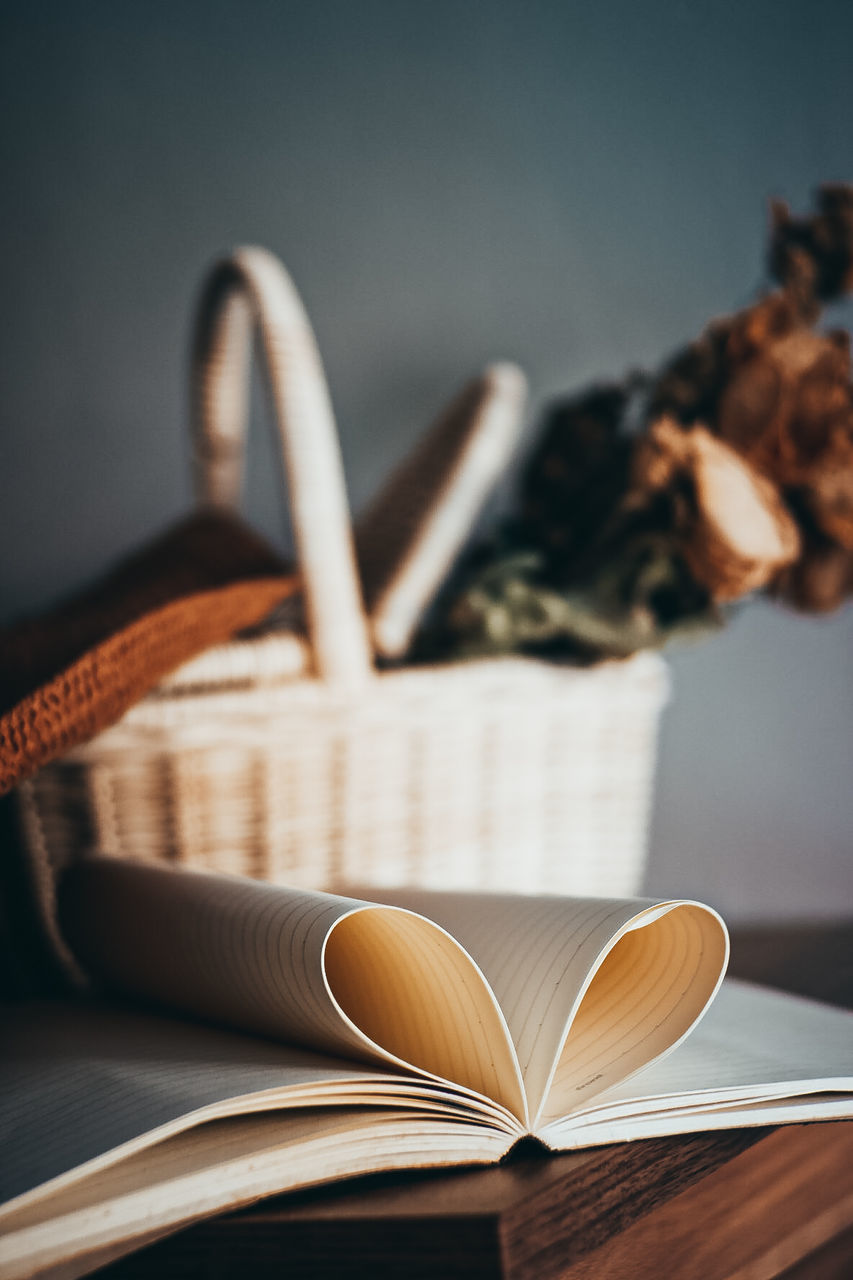 book, publication, page, close-up, indoors, no people, literature, wood, paper, brown, reading, education, still life, open, wisdom, studio shot, table, activity